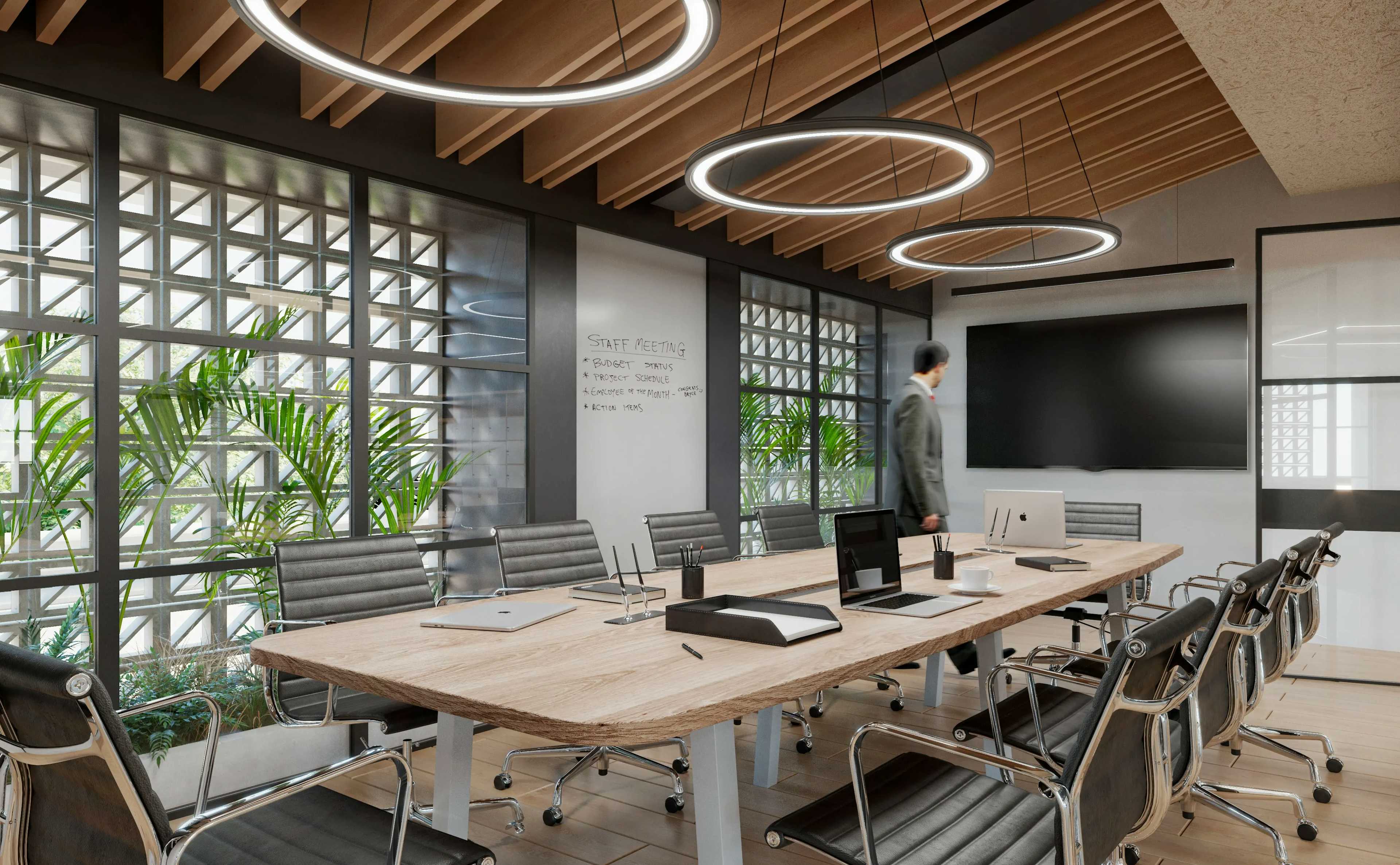Proyecto de oficinas en Cozumel, Quintana Roo. Sala de juntas con sillas de oficina y mesa de oficina de madera.